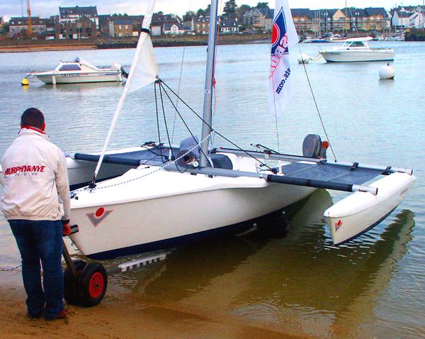 Beach launching a Magnum 21 Trimarans - 
note large wheels replace jockey wheel
